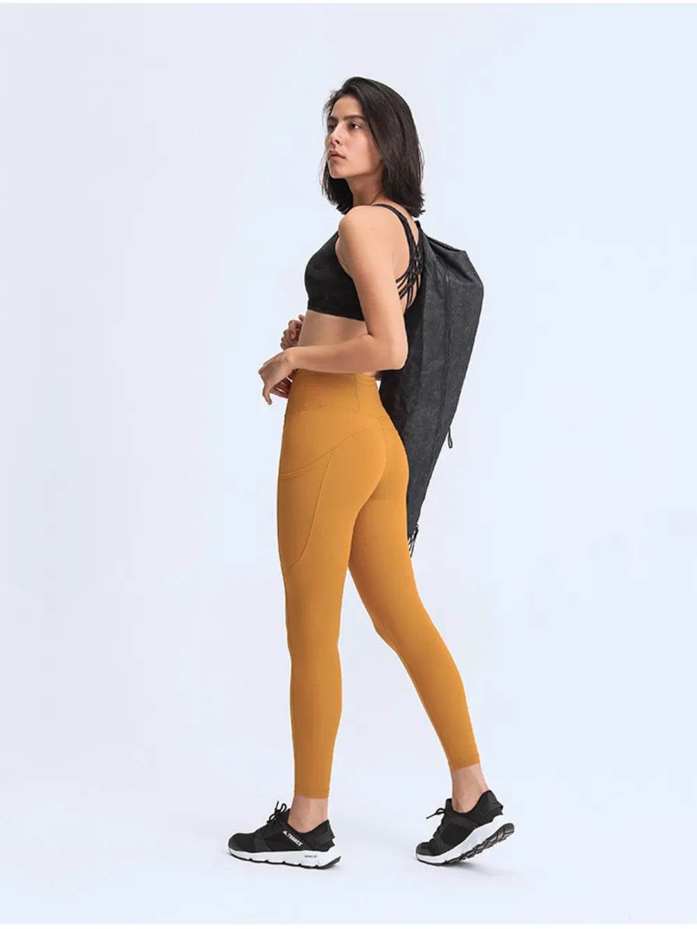 Millennia Wide Waistband Leggings with Pockets Trendsi 04623110de224d1da8daeea225c8c631-Max