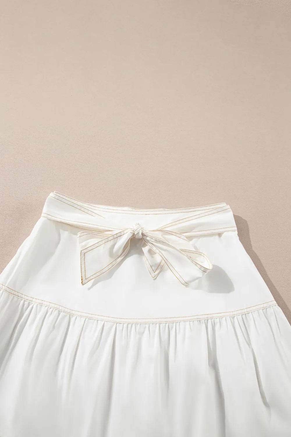 Contrast Stitching Trim Knotted High Waist A-Line Mini Skirt Trendsi 286dee42-a823-4e1e-ae24-e68c06fa41f1-Max