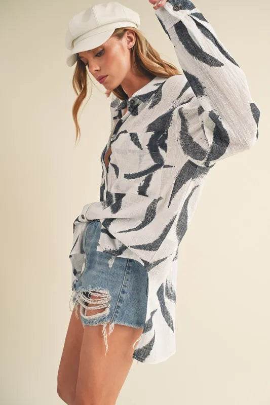 Aemi + Co High-Low Printed Button Up Long Sleeve Shirt Trendsi 30017264-c7c0-451e-b8ef-73703c50a3b9-Max