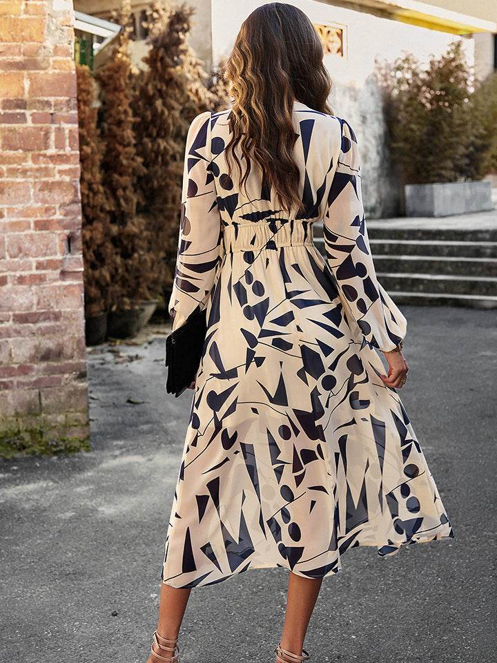 Devine Printed V-Neck Long Sleeve Midi Dress Trendsi 419f08b20e1a484595e3e63721bd688a-Max