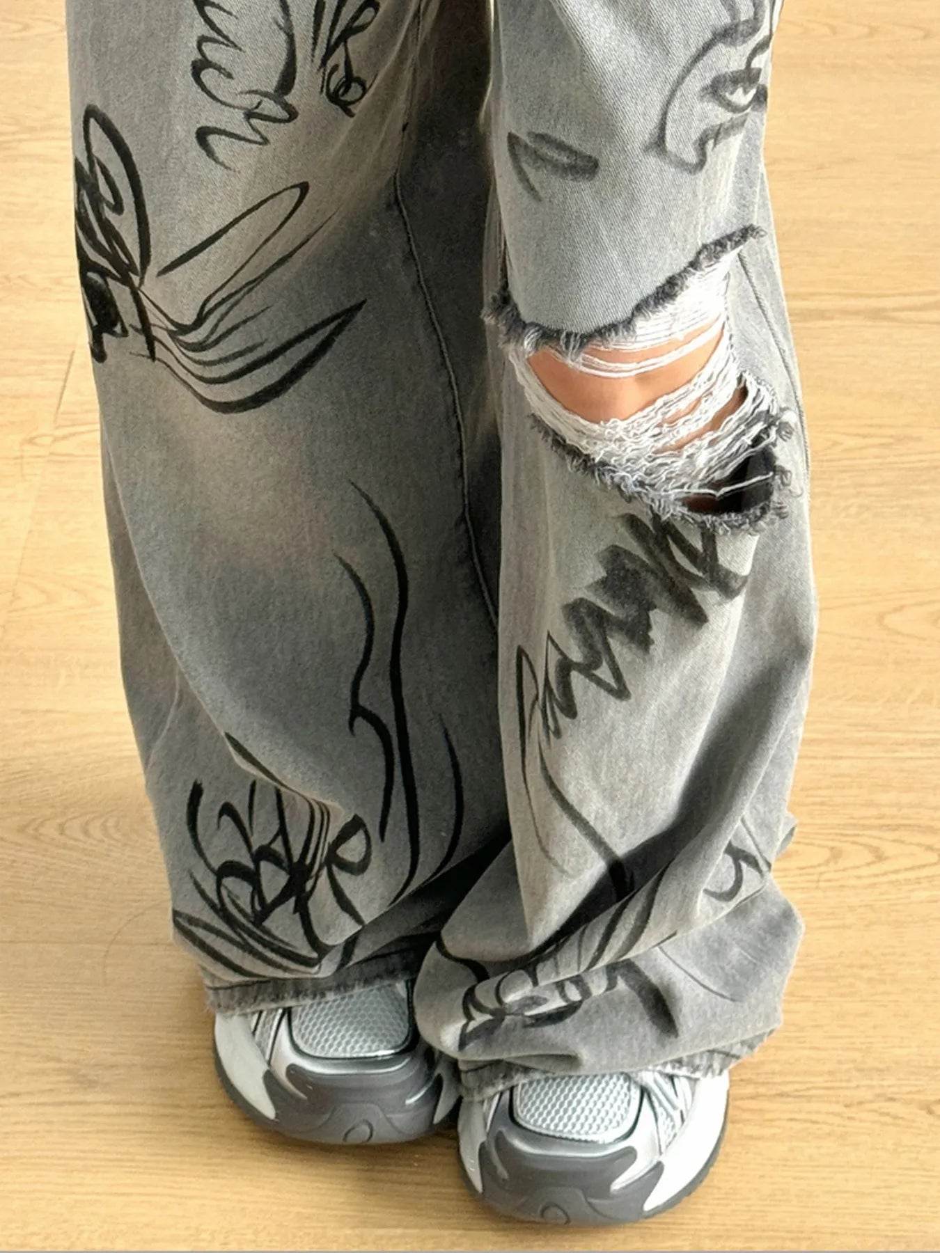 Printed Distressed Wide Leg Jeans Trendsi 4b91ceee12134093b7bf746a605275d3-Max-Origin