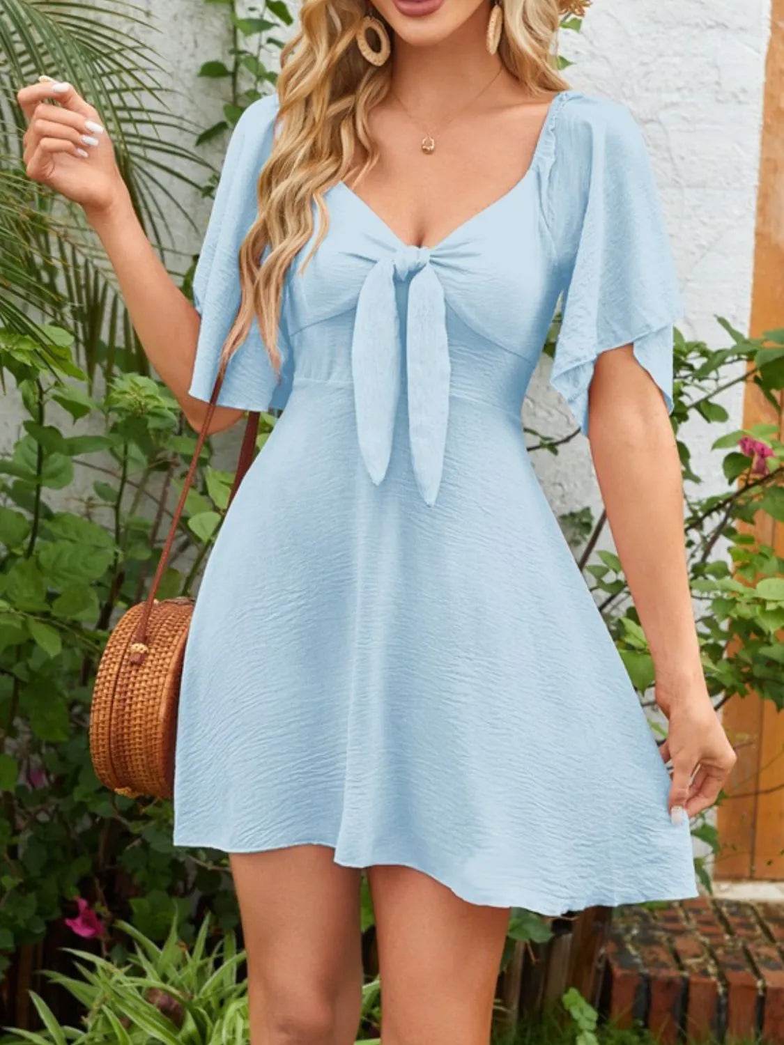 Smocked Back Knotted Flutter Sleeve Dress Trendsi 5394a8af-9331-4cc4-8bc3-1c8a4b4cd873-Max-Origin