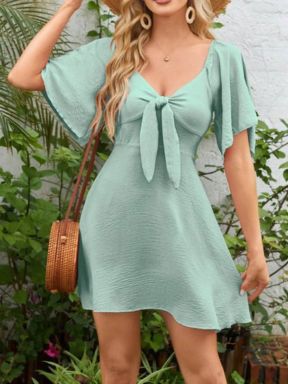 Smocked Back Knotted Flutter Sleeve Dress Trendsi 6ab4107b-8b52-49a9-b9b9-12771772494f-Max-Origin