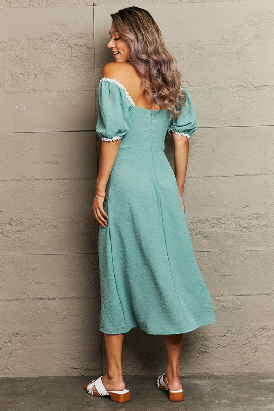 Perfee Swiss Dot Slit Off-Shoulder Dress Trendsi 70d1d2ce4f80449bb28cc29e5b0cad62-Max