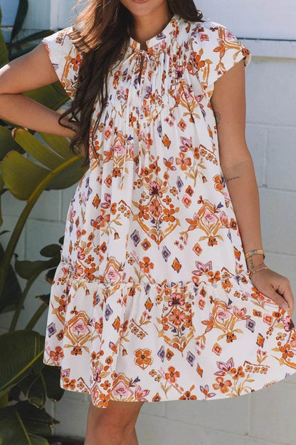 Printed Tie Neck Cap Sleeve Mini Dress Trendsi 7388c31f-5258-4c71-a1db-2e7afea4133c-Max-Origin