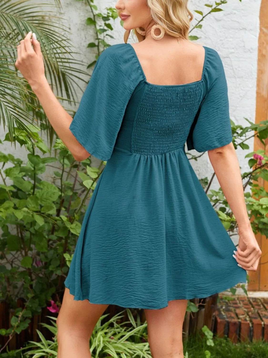 Smocked Back Knotted Flutter Sleeve Dress Trendsi 90acbac3-317c-42a7-bffe-b0b692b2ee56-Max-Origin