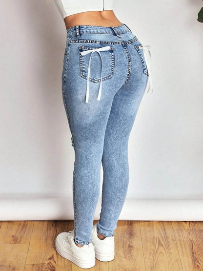 Distressed Skinny Jeans with Bow Back Trendsi a3a8b264-e49a-49cb-921e-73966cf0123f-Max-Origin