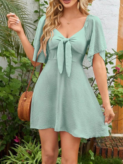 Smocked Back Knotted Flutter Sleeve Dress Gum Leaf Trendsi c01040ff-b59c-4ec7-acd3-d559e37f6760-Max-Origin