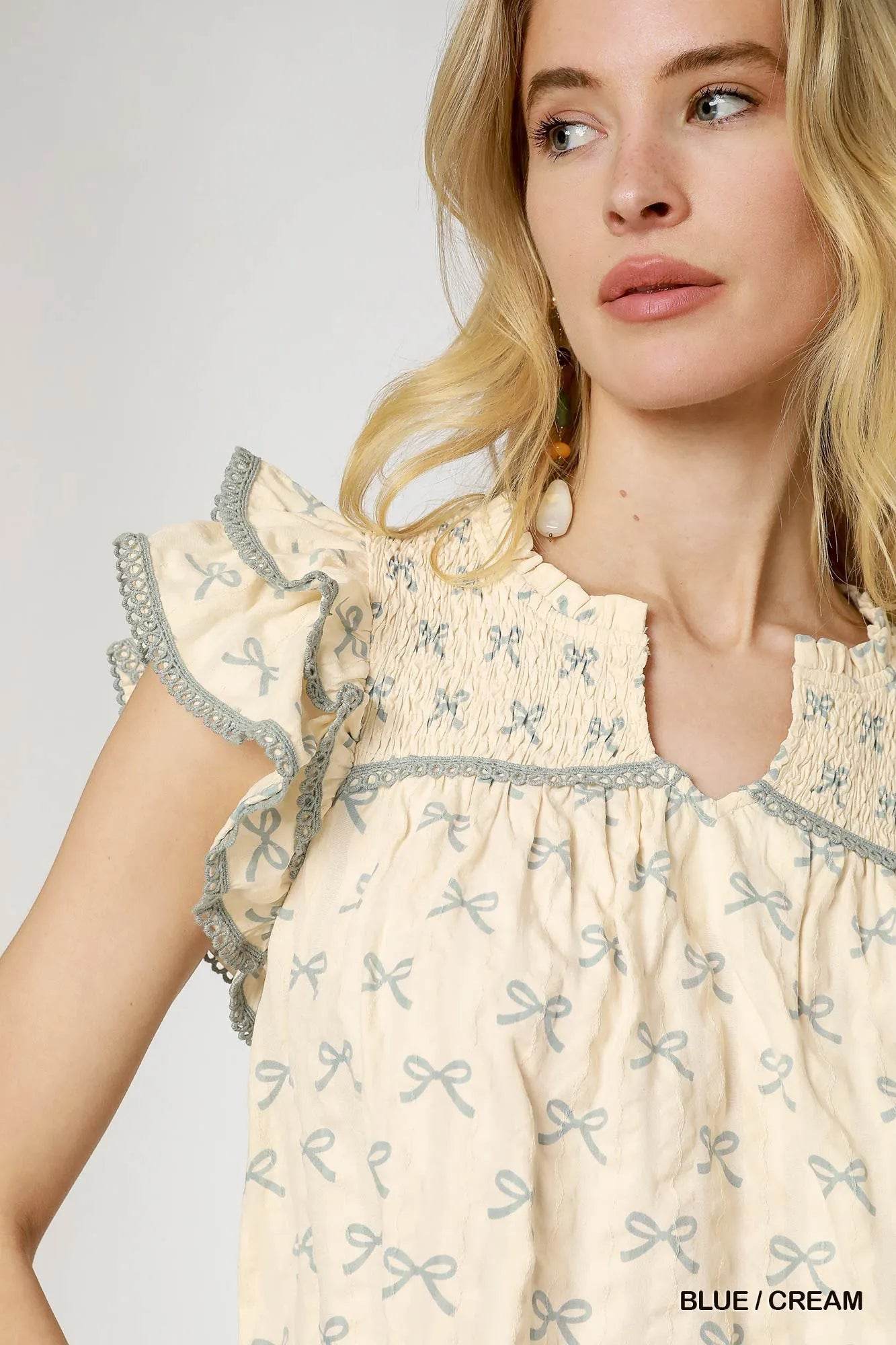 Umgee Bow Print Ruffled Cap Sleeve Mini Dress Trendsi cbc6fa85-a20c-460b-afc9-416fc1067677-Max-Origin
