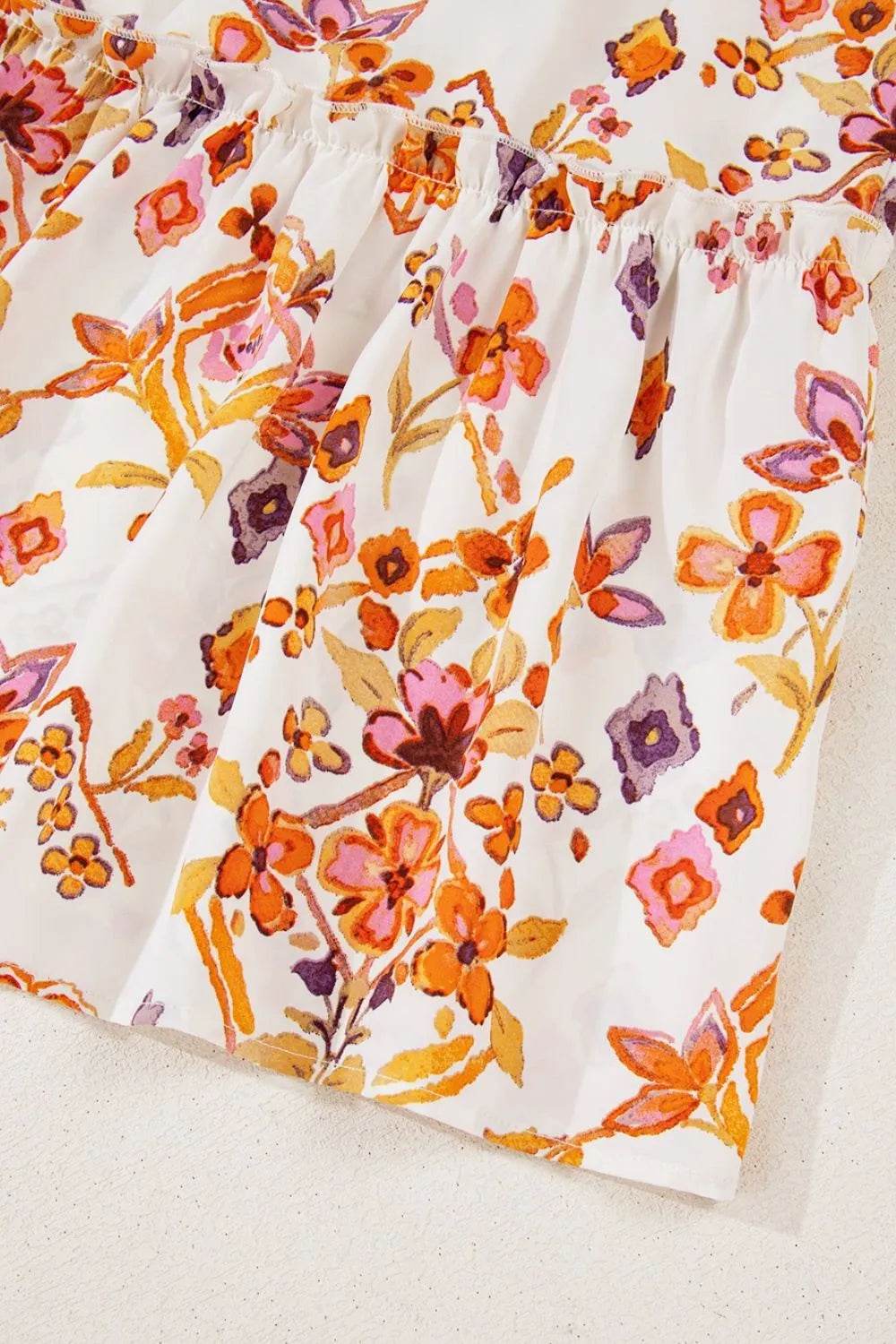 Printed Tie Neck Cap Sleeve Mini Dress Trendsi d9ba0364-ce79-466c-b8af-2c6eff3c9e66-Max-Origin