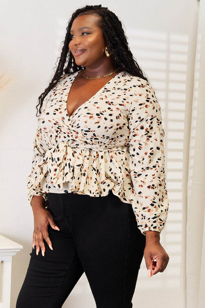 Honey Printed Tied Plunge Peplum Blouse Trendsi dd649f3ccc1f49a0bb30800917a4e4c6-Max