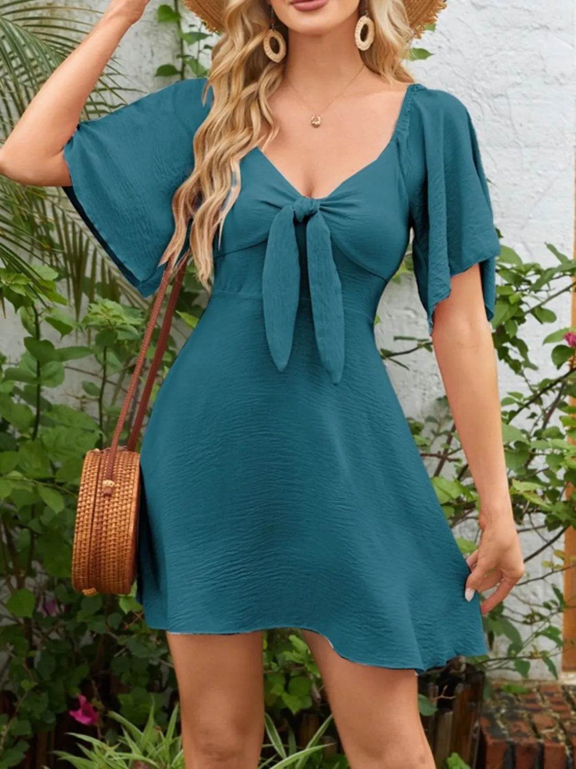 Smocked Back Knotted Flutter Sleeve Dress Trendsi eb6498bf-70b0-4c29-83dd-20d94890fa60-Max-Origin